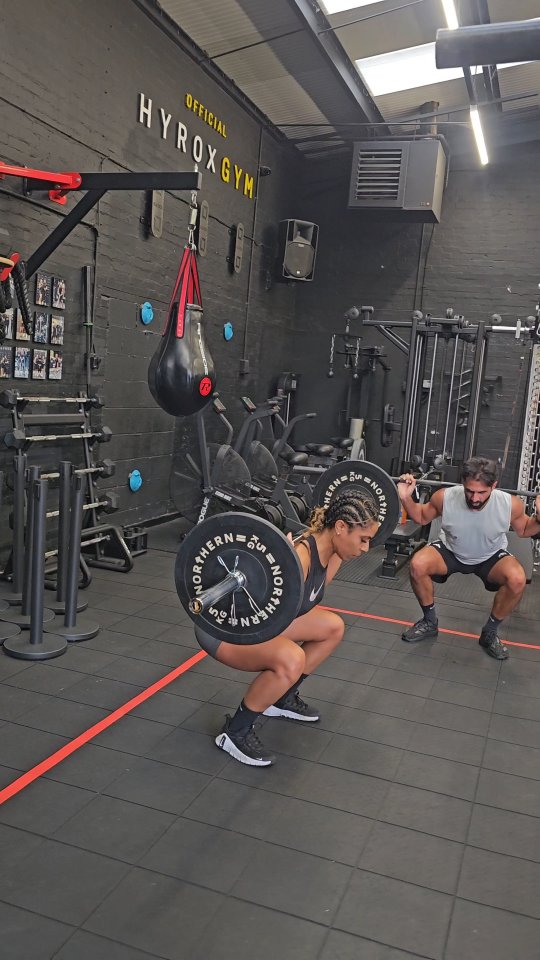 Members finishing a METCON on the gym floor